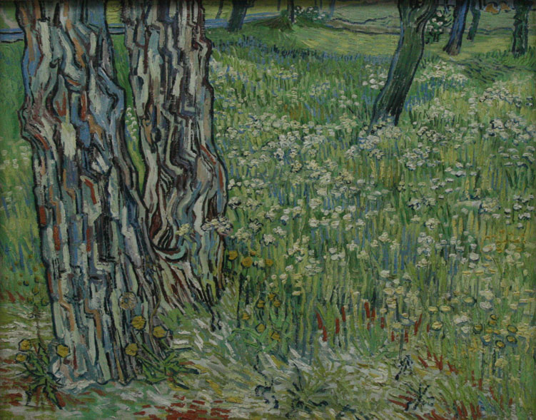 梵高风景作品：树林中开满花的草地