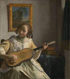 维米尔作品: 吉他演奏者 - woman playing the guitar